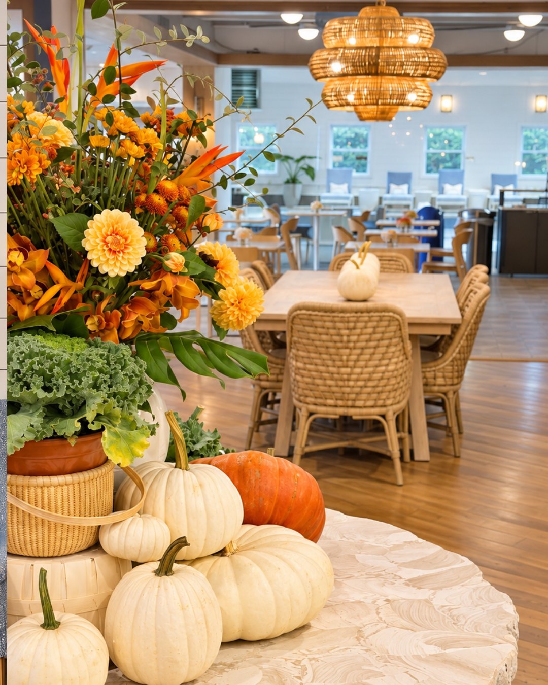 The Nantucket Inn dining room with rattan chairs and fall florals