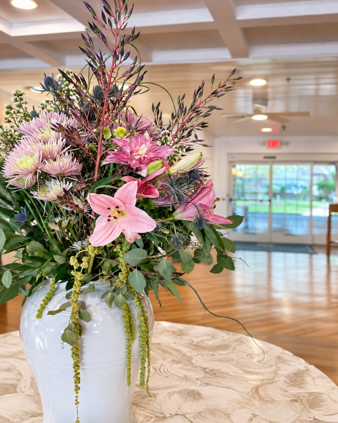 Fresh flowers in a white ginger jar in the Nantucket Inn lobby