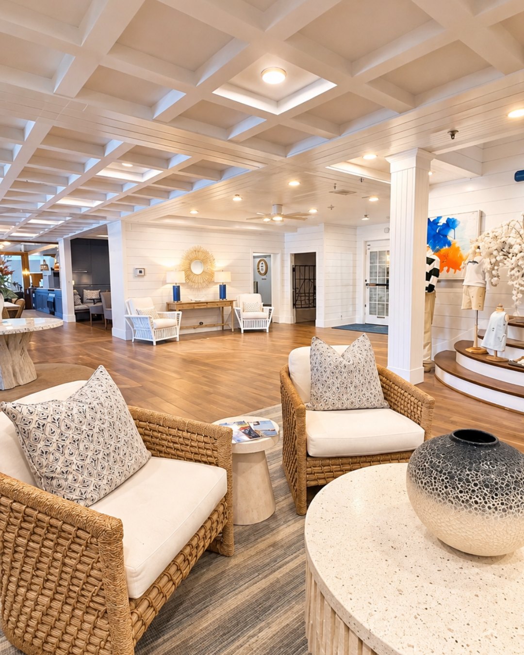 Woven lounge chairs and a coffered ceiling in the Nantucket Inn lobby