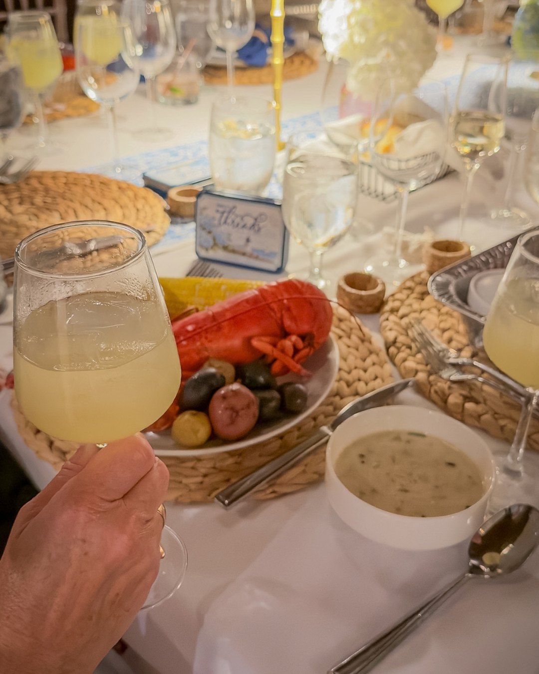 A toast over lobster and clam chowder at the THREADS welcome dinner